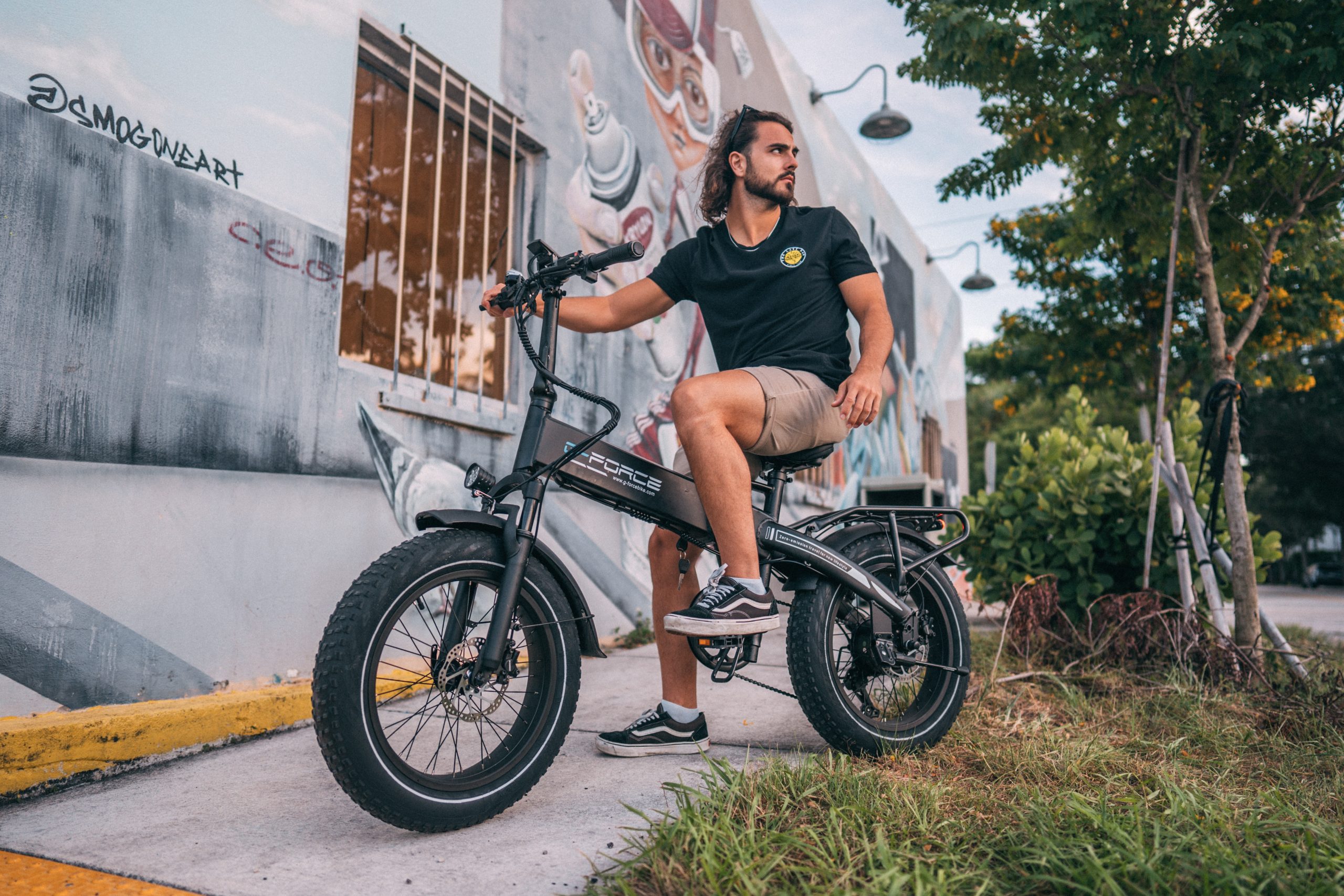 man sitting down on his fat tire e-bike
