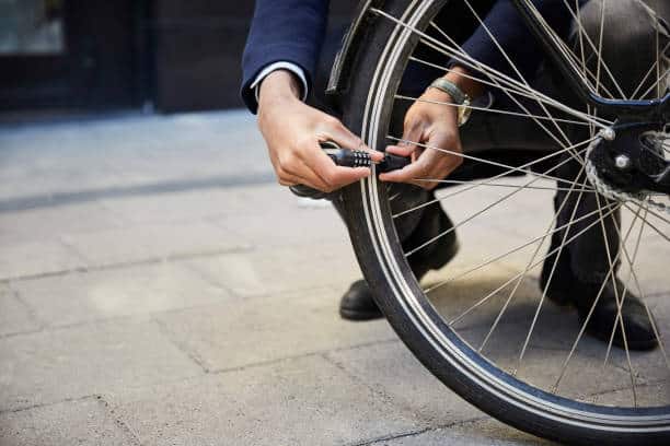 Man checking his tire air pressure