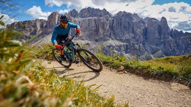 MTB mountain biking outdoor on the Dolomites: enduro discipline over a single trail track