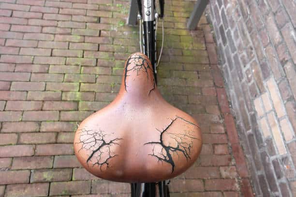 close up of a broken saddle leather from a bicycle