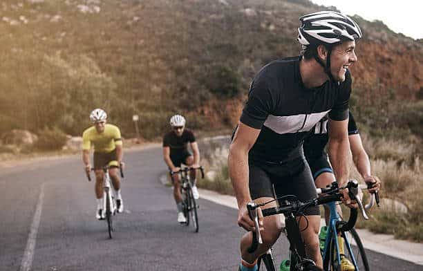 man riding his e-bike with friends