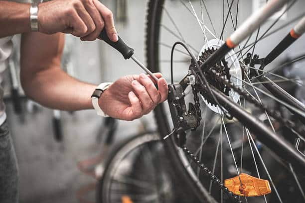 man fixing his e-bike tire