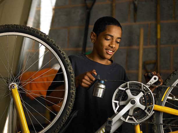 man looking at the bottom bracket of his bike