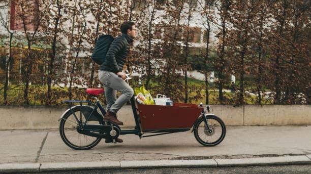 Delivery boy on a cargo bike