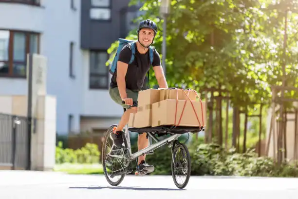 man riding cargo bike