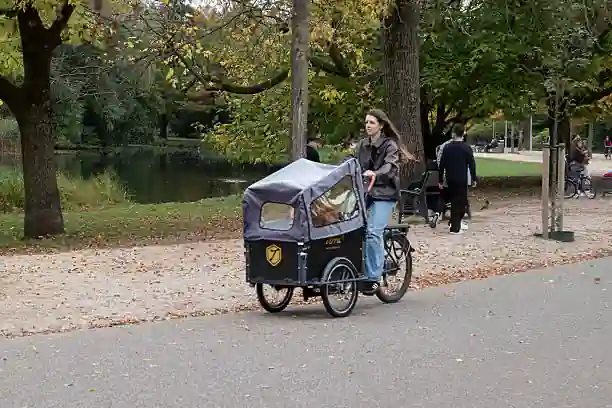 woman riding cargo e-bike