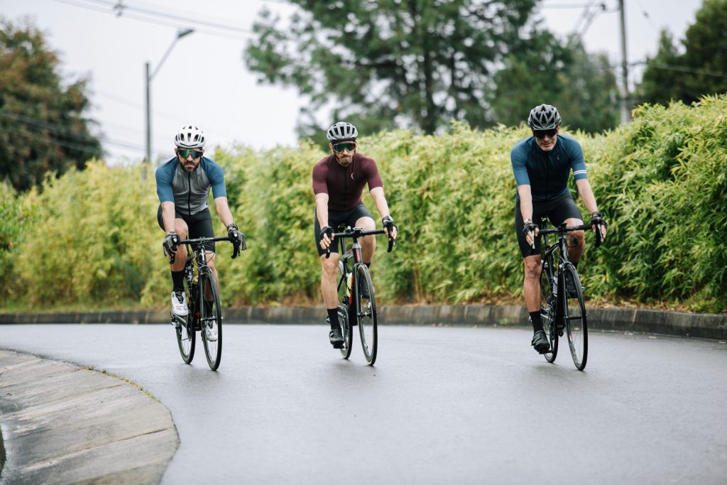 three men riding an e-bike
