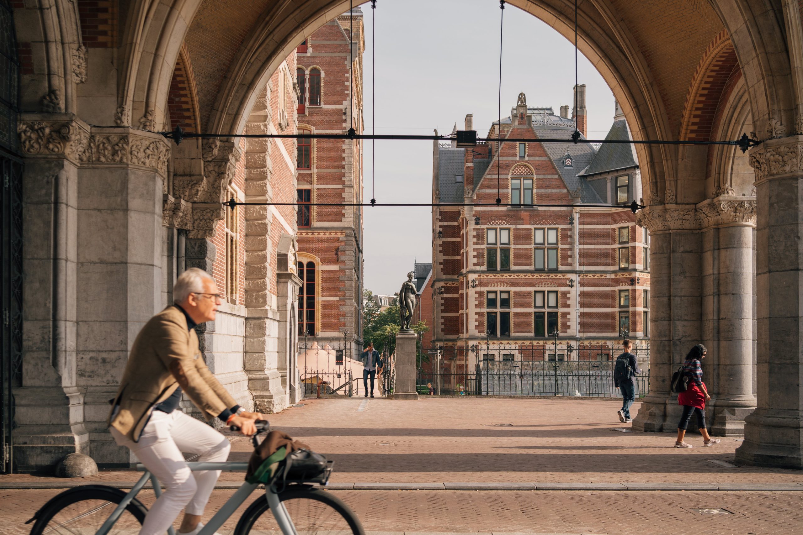 man riding step through e-bike
