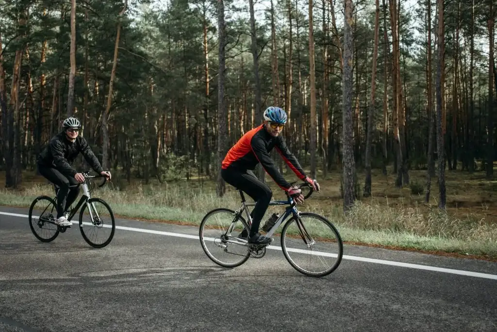 2 men riding on bikes