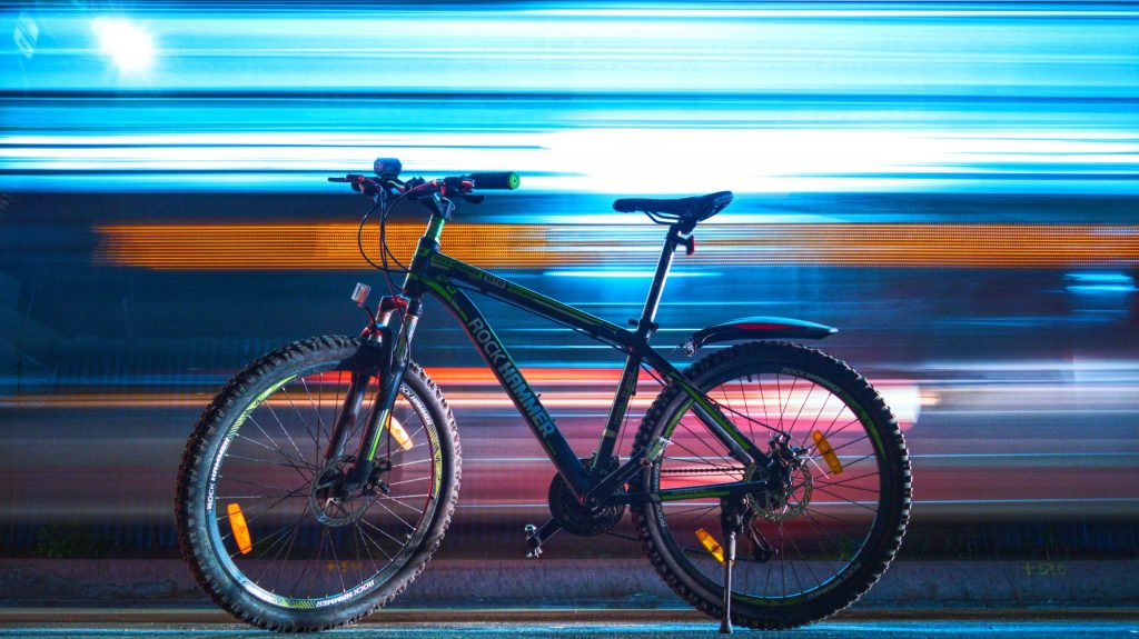 e-bike with cars moving behind it